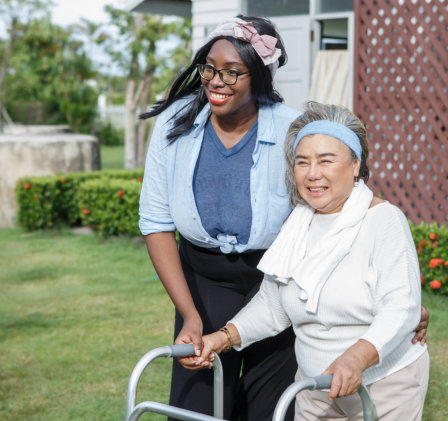 carer assisting senior outdoor