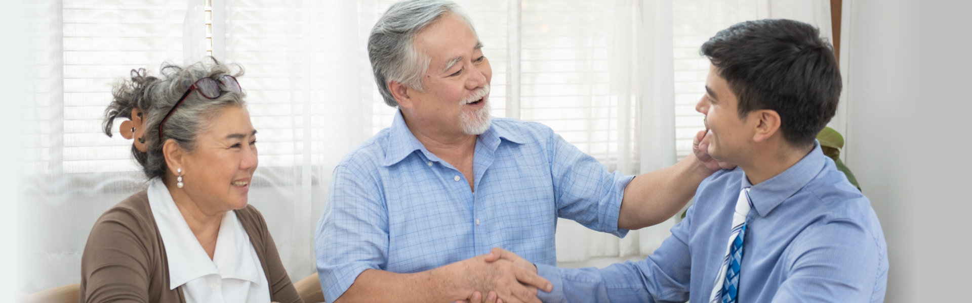 senior couple talking to an advisor