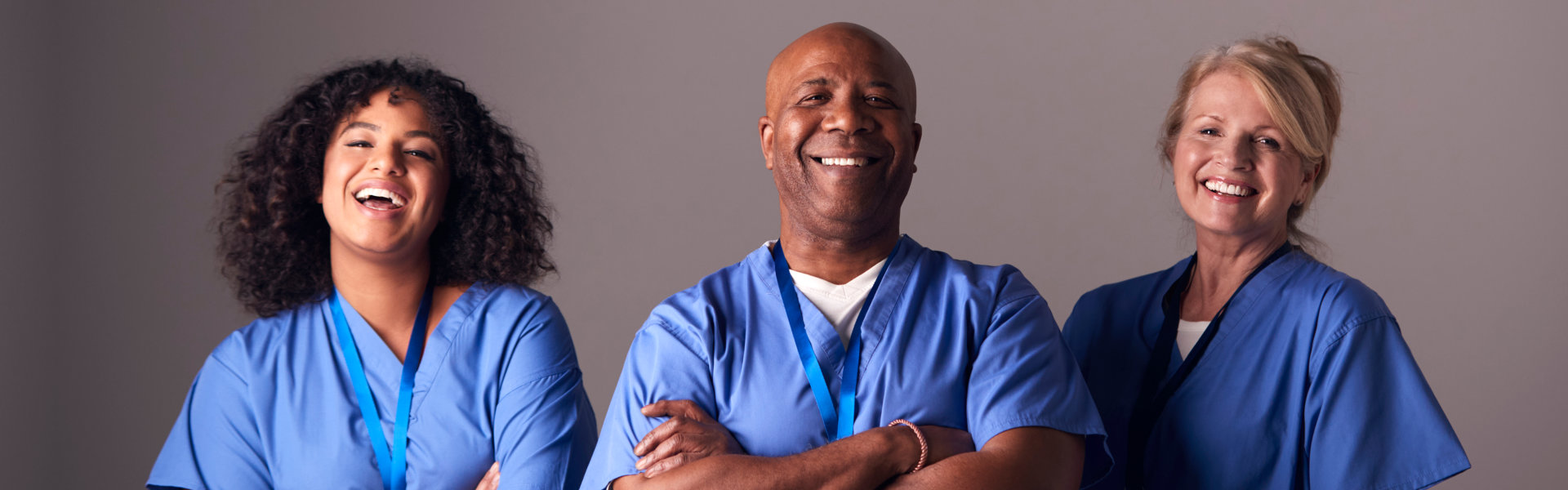 three caregivers smiling