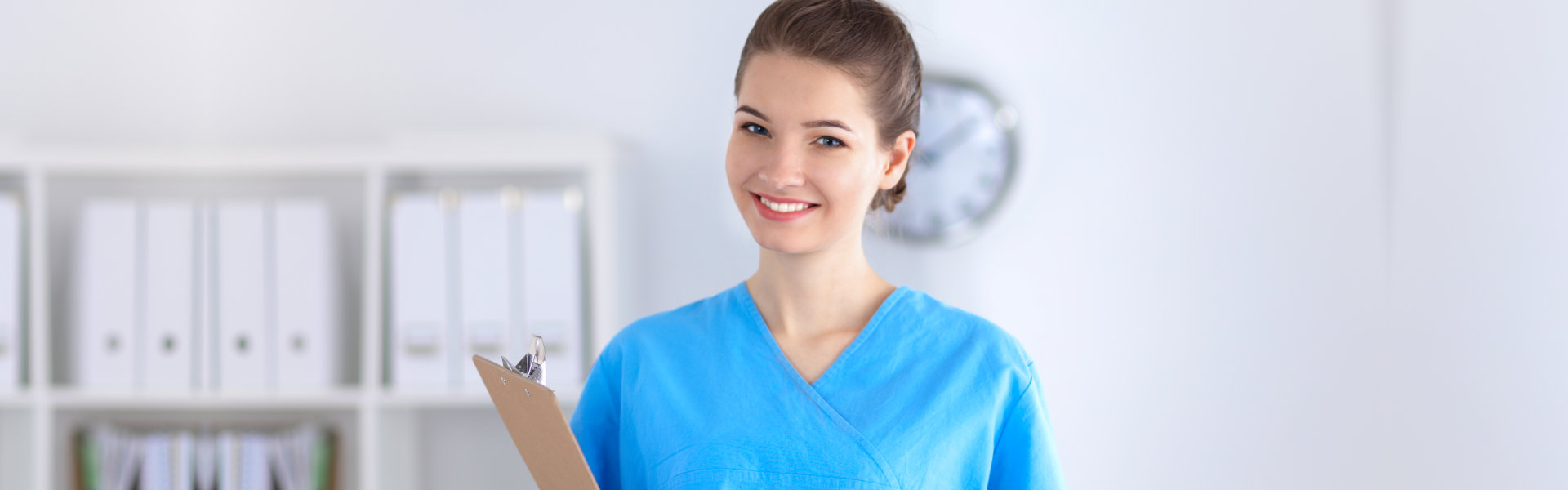 young caregiver holding a clipboard