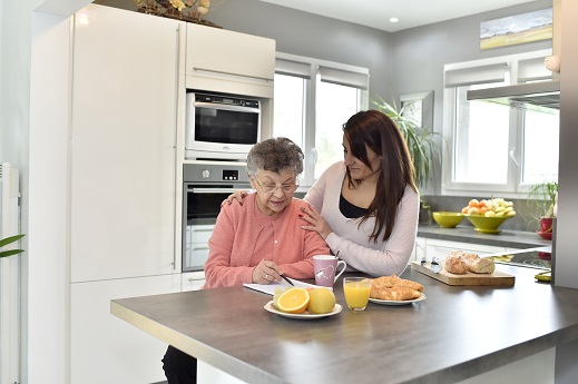 young woman and elderly at home